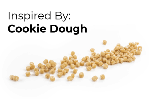 Inspired By-Cookie Dough Header image with cookie dough inclusions spilled on white background