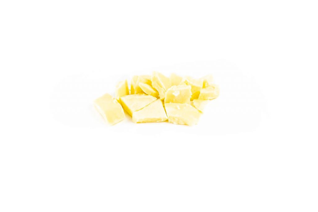 solid pieces of cocoa butter against white background